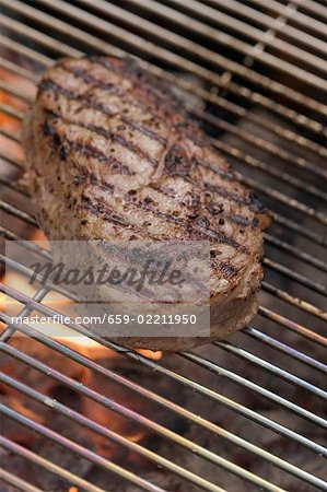 Beef steak on a barbecue