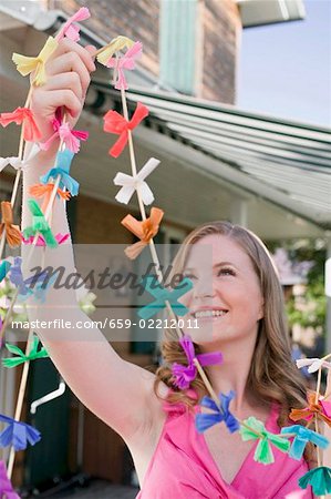 Woman with coloured garlands for garden party