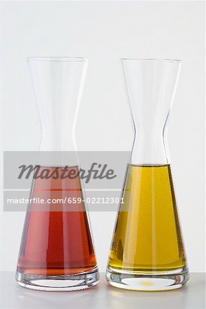Raspberry vinegar and olive oil in carafes
