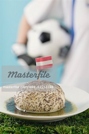 Yeast dumpling with flag, footballer in background