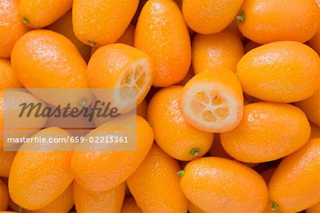 Many kumquats, one halved Many kumquats, one halved