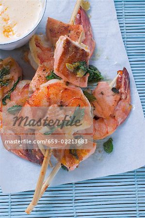 Salmon and prawn skewers with mint and sauce