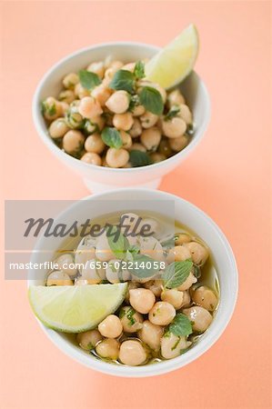 Chick-peas with lime wedges and herbs