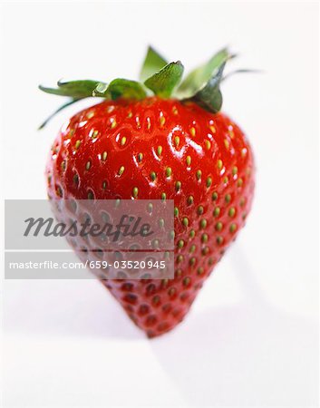 A Single Strawberry on White Background