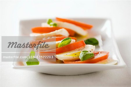 Tomatoes with mozzarella and basil