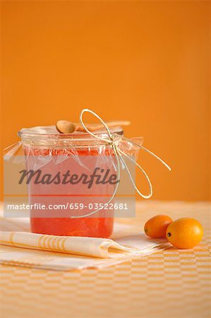 Orange and kumquat marmalade in jam jar