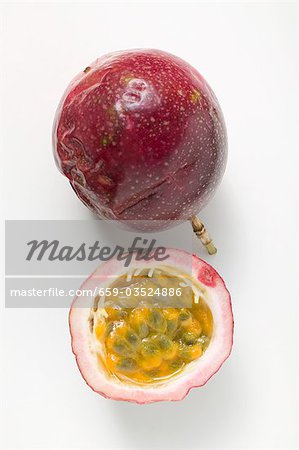 Purple passion fruits, whole and half