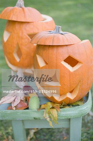Carved pumpkin faces on garden table