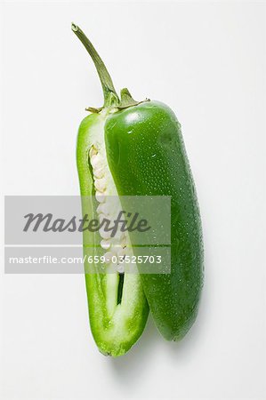 Green chilli with drops of water, halved