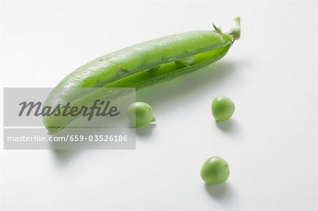 Pea pod, opened, and three peas