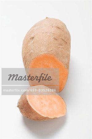 A sweet potato with a piece cut off