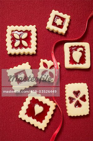 Seven square jam biscuits with red ribbon