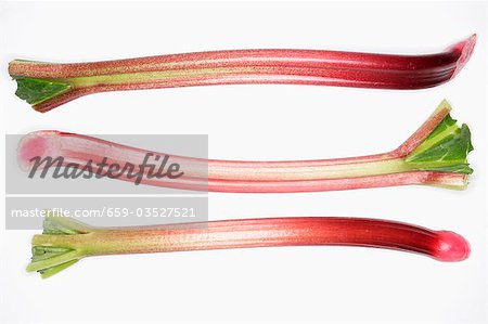 Three sticks of rhubarb side by side