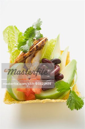 Chicken, vegetables, lime & coriander leaves in corn shell