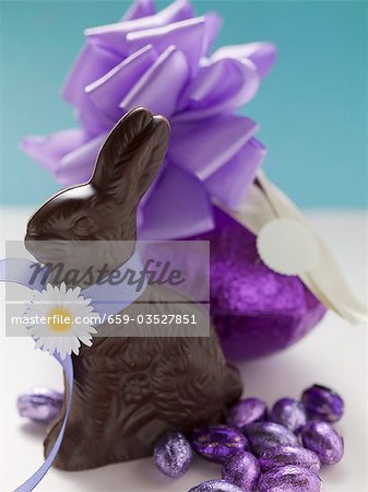 Chocolate Bunny and chocolate Easter eggs in purple foil