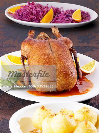 Roast duck with potato dumplings and red cabbage