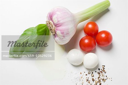 Garlic, tomatoes, mozzarella, spices, oil and basil