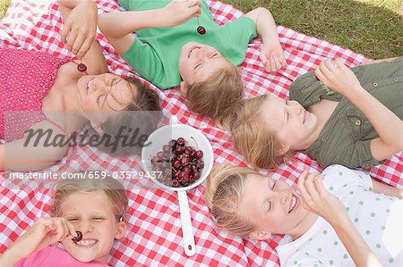 Children eating cherries
