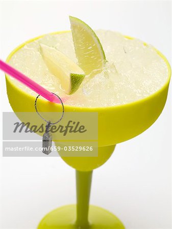 Frozen Margarita with lime wedges Frozen Margarita with lime wedges