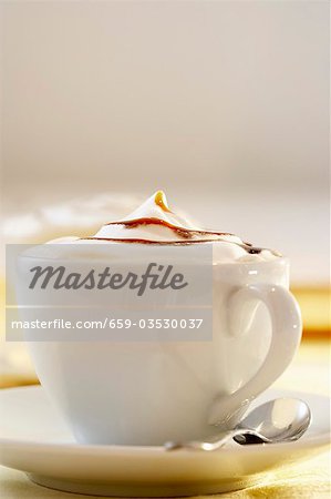 A cup of cappuccino with caramel