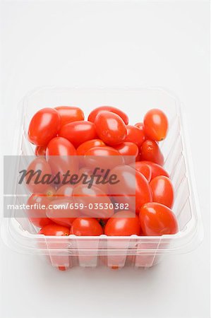 Plum tomatoes in plastic container
