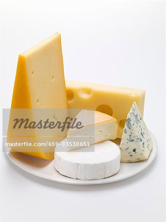 Pieces of different cheeses on plate