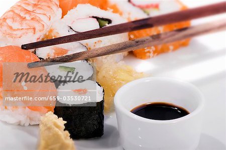 Maki sushi & nigiri sushi with soy sauce & pickled ginger