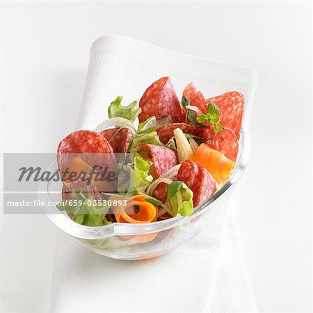 Salami salad with carrots and baby corn