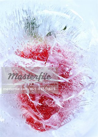 Strawberry in block of ice (close-up)