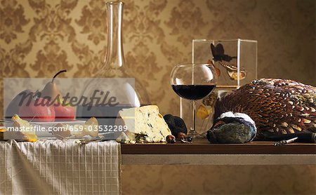 Still life with pheasant, cheese and wine