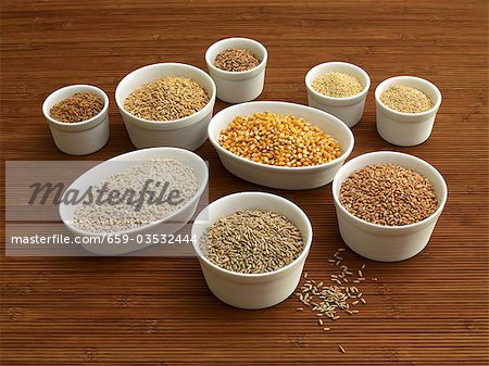 Various types of cereal grains in small bowls