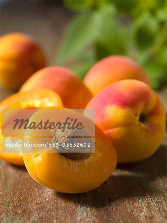 Fresh apricots, one halved