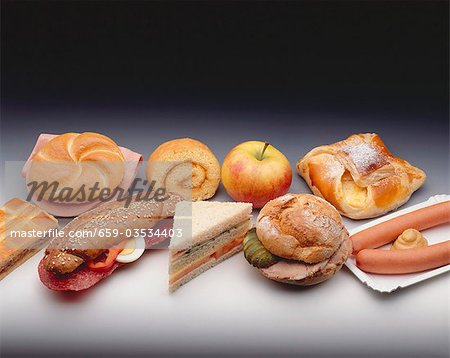 Assorted snacks, baked goods, filled rolls and sausages
