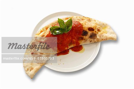 Calzone with tomato sauce and basil