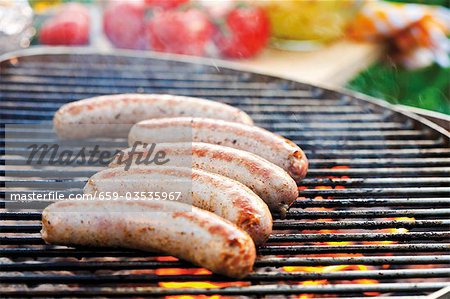 Sausages on barbecue rack Sausages on barbecue rack