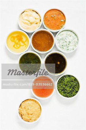 Assorted salad dressings in small dishes from above