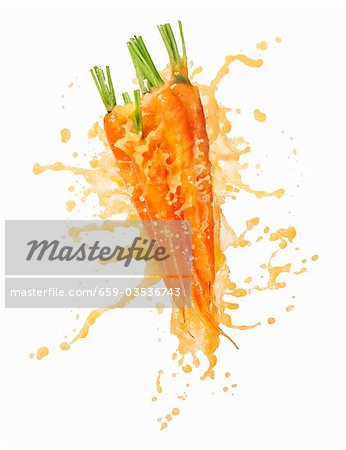 Download Carrots With Splashing Carrot Juice Stock Photo Masterfile Premium Royalty Free Code 659 03536743 Yellowimages Mockups