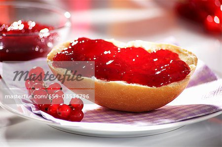 Redcurrant jam on bread roll