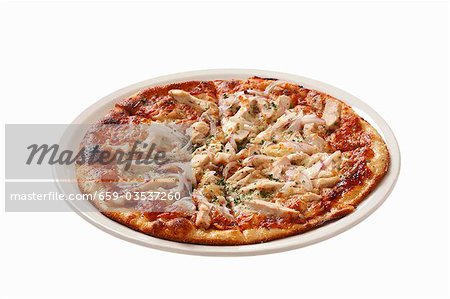 Pizza topped with chicken, mushrooms and red onions