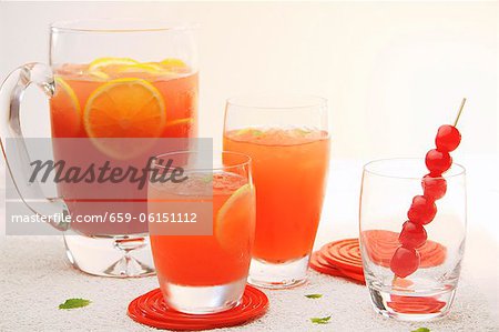 Fruit punch in glasses and a glass jug