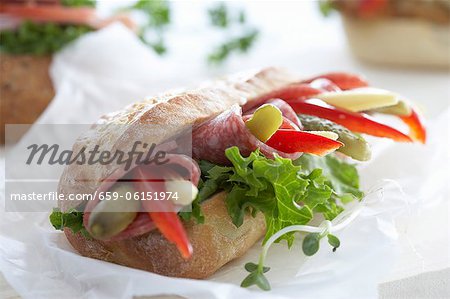 Ciabatta with salami, pepper, gherkins and baby corn cobs