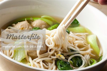 Hand Twirling Noodles from Shanghai Noodle Meatball Soup onto Chopsticks