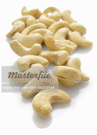 Cashew nuts on a white surface