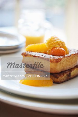 French Toast Made with Brioche; Topped with Marinated Oranges and Kumquats