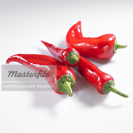 Four red pointed peppers Four red pointed peppers