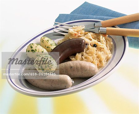 Black pudding and liver sausage with sauerkraut and parsley potatoes