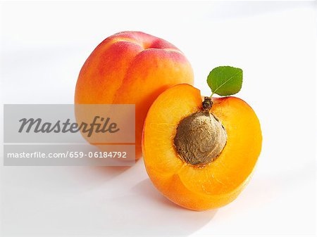 Whole and half apricot