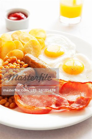 English breakfast with orange juice and ketchup