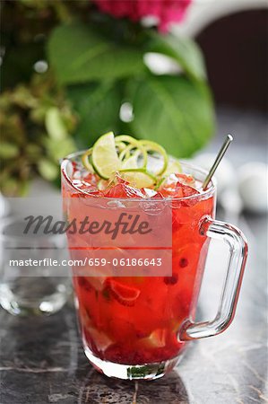 A vodka cocktail with raspberries and oranges A vodka cocktail with raspberries and oranges