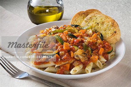 Penne with Vegetable Marinara Sauce and Two Pieces of Garlic Bread - Stock  Photo - Masterfile - Premium Royalty-Free, Code: 659-06186678